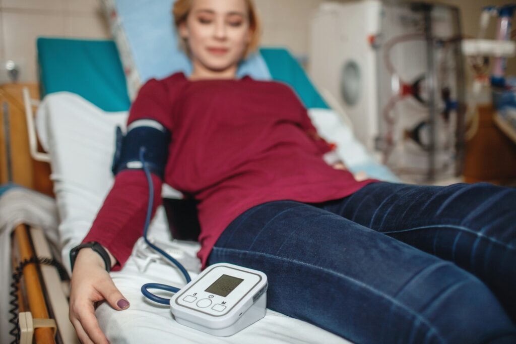 Young girl on hemodialysis in hospital, dialysis system equipment, kidney disease chronic patient